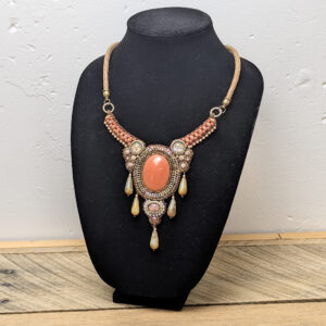 Ornate Beaded Necklace with Coral-Colored Stone